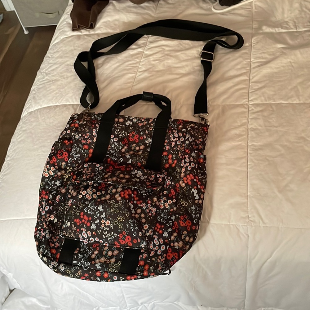 Cute floral bag the straps adjust into a backpack or cross body
